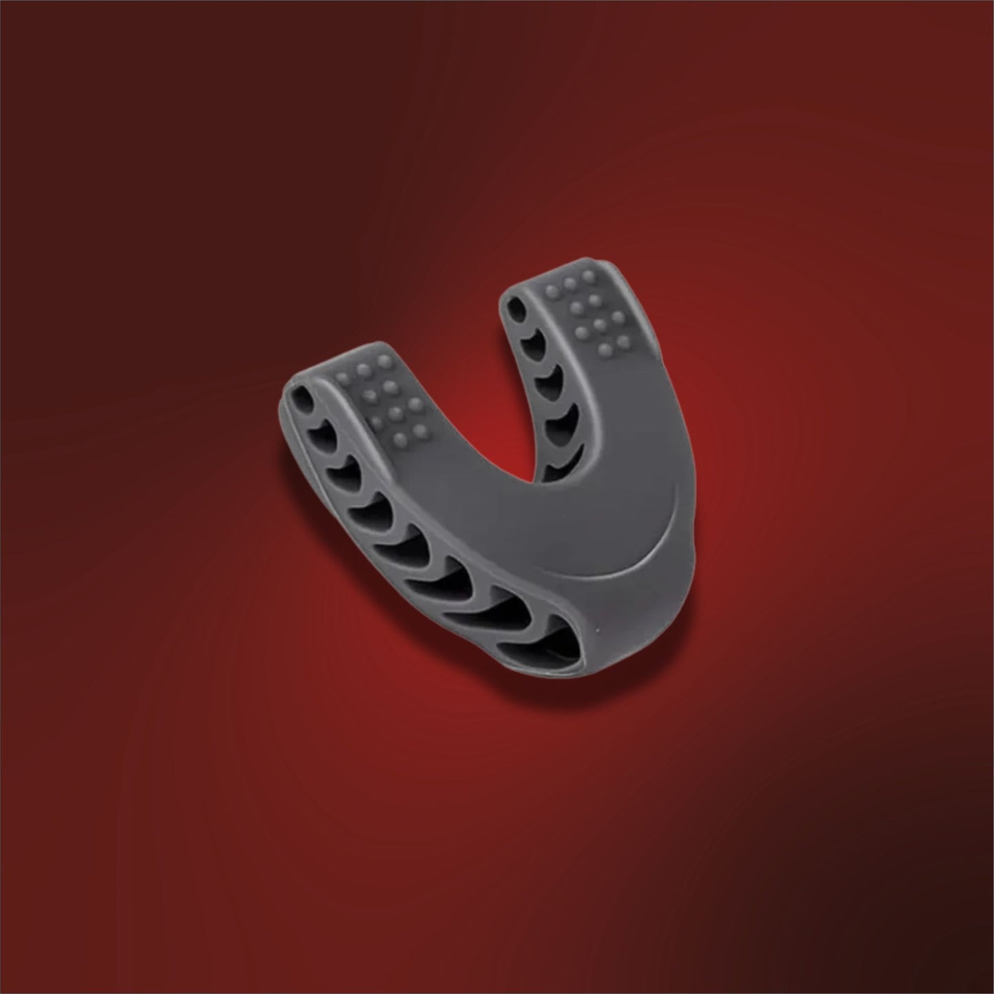 Gray U-shaped plastic component on a red background
