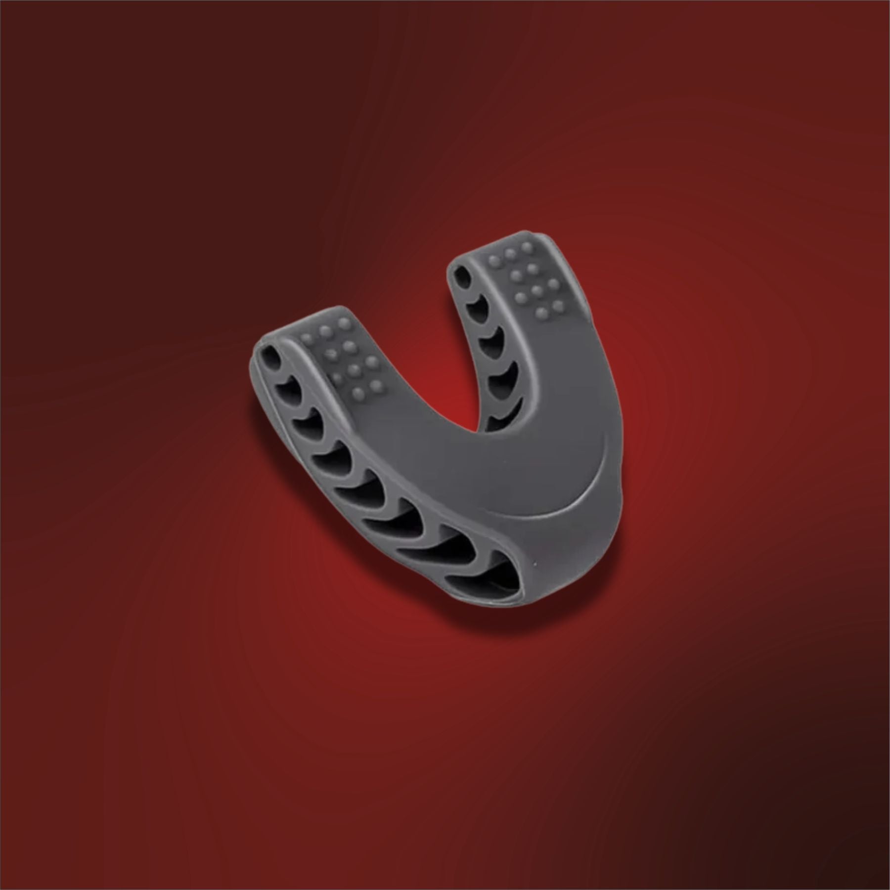 Gray U-shaped plastic component on a red background