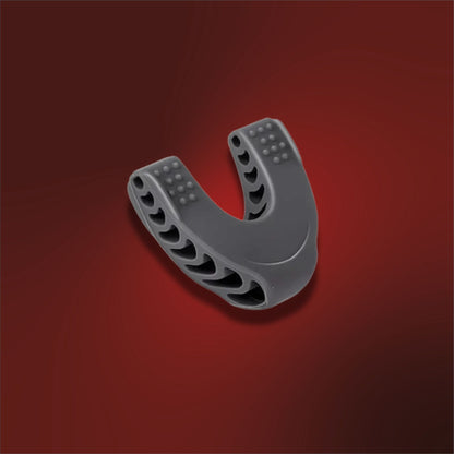 Gray U-shaped plastic component on a red background